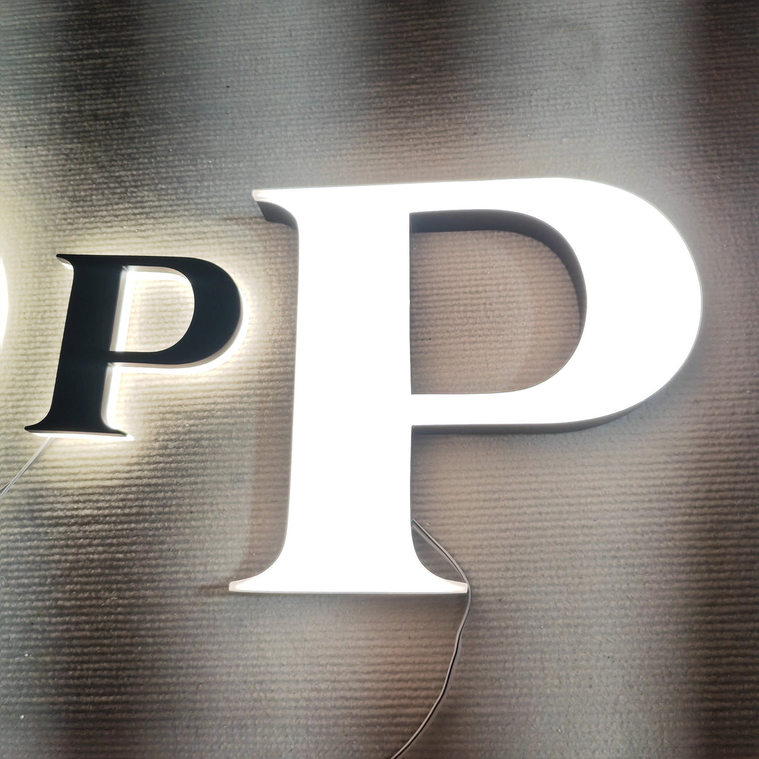 Custom painted stainless steel 3D letters reverse lit channel letters exterior company wall brand signs