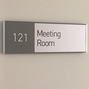 Interior signgae ADA sign raised letters wayfinding office building sign wall conference room sign braille signage