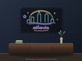 Atlanta Skyline Neon Sign shown above a walnut console in a styled room mockup