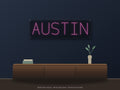 Austin City Name Neon Sign shown above a walnut console in a styled room mockup