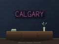 Calgary City Name Neon Sign shown above a walnut console in a styled room mockup
