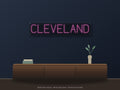 Cleveland City Name Neon Sign shown above a walnut console in a styled room mockup