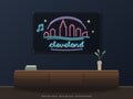 Cleveland Skyline Neon Sign shown above a walnut console in a styled room mockup