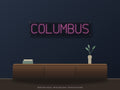 Columbus City Name Neon Sign shown above a walnut console in a styled room mockup