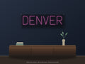 Denver City Name Neon Sign shown above a walnut console in a styled room mockup