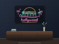 Hollywood Skyline Neon Sign shown above a walnut console in a styled room mockup
