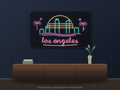 Los Angeles Skyline Neon Sign shown above a walnut console in a styled room mockup