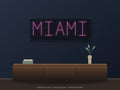 Miami City Name Neon Sign shown above a walnut console in a styled room mockup