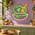 Design Preview: Matcha Daydream Neon Sign in a playful contemporary matcha cafe with muted lavender walls, a sage-green tiled counter, cream ceramics and a bamboo whisk; bright daylight. Generated room visualization, predefined colors shown.
