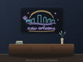 New Orleans Skyline Neon Sign shown above a walnut console in a styled room mockup