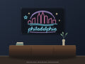Philadelphia Skyline Neon Sign shown above a walnut console in a styled room mockup
