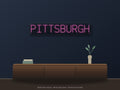 Pittsburgh City Name Neon Sign shown above a walnut console in a styled room mockup