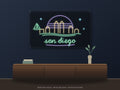 San Diego Skyline Neon Sign shown above a walnut console in a styled room mockup