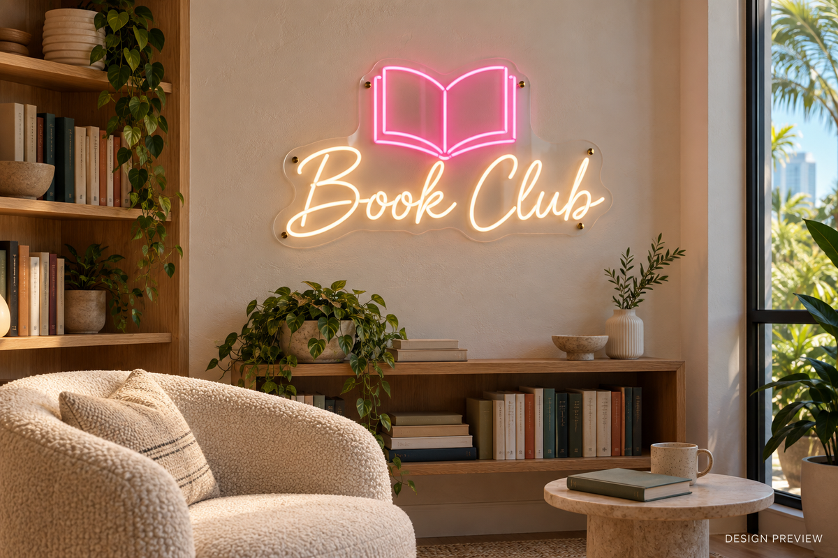 Book Club LED neon sign with soft-white script and pink open-book icon in a reading nook - design preview