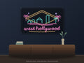 West Hollywood Skyline Neon Sign shown above a walnut console in a styled room mockup